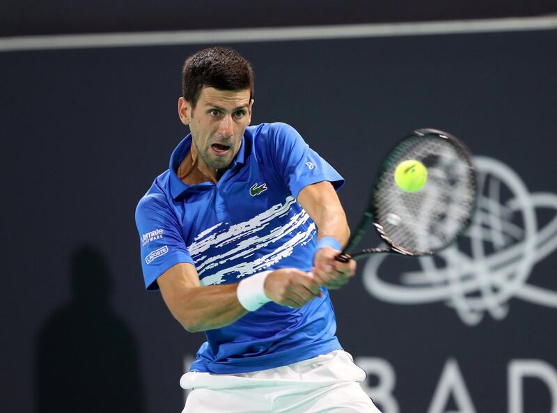 Abu Dhabi, United Arab Emirates - Reporter: Jon Turner: Novak Djokovic hits a shot during the semi final between Novak Djokovic v Stefanos Tsitsipas at the Mubadala World Tennis Championship. Friday, December 20th, 2019. Zayed Sports City, Abu Dhabi. Chris Whiteoak / The National