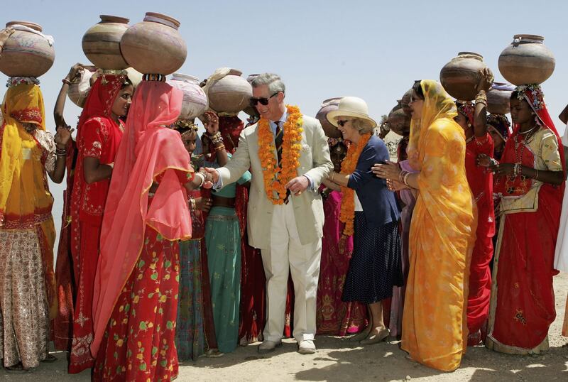 Camilla, Duchess of Cornwall, and Prince Charles visit Artiya village in Delhi, India, in 2006. 