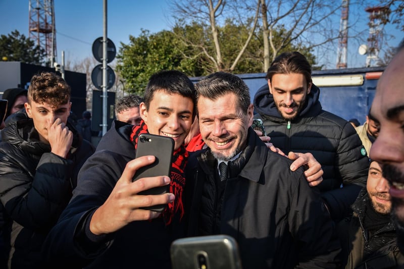 Milan supporters make a selfie with Croatian former player Zvonimir 'Zorro' Boban as they wait for the arrival of Zlatan Ibrahimovic. EPA