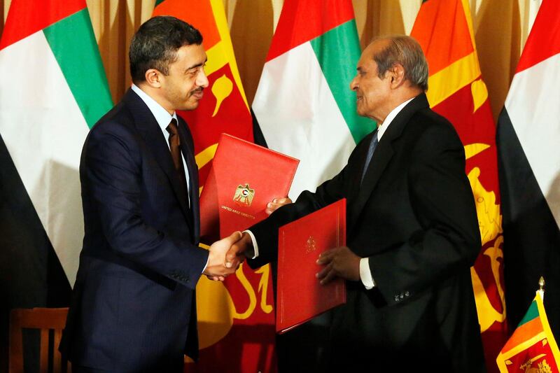 epa06336666 Minister of Foreign Affairs and International Cooperation of the United Arab Emirates Sheikh Abdullah bin Zayed Al Nahyan (L) and Sri Lanka's Foreign Minister Tilak Marapana (R) exchange signed agreements at the Foreign Ministry in Colombo, Sri Lanka 18 November 2017. Abdullah bin Zayed is on a short official visit to Sri Lanka to further strengthen relations between the two countries. Abdullah bin Zayed will also meet Sri Lanka's President Maithripala Sirisena during his visit.  EPA/M.A.PUSHPA KUMARA