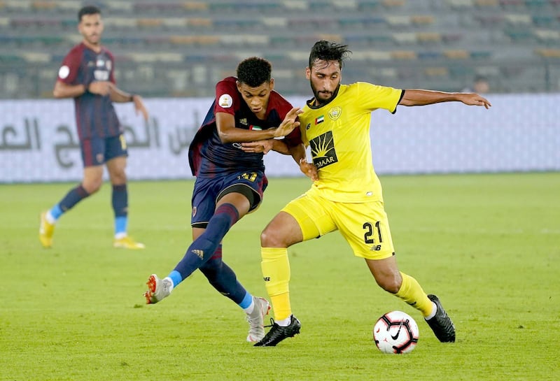 Al Wahda’s Yahya Al Ghassani (20) is challenged by two Al Wasl players in the Arabian Gulf Cup which Wahda won 3-0 on Sunday at the Zayed Sports City stadium. Courtesy Al Wahda.        
