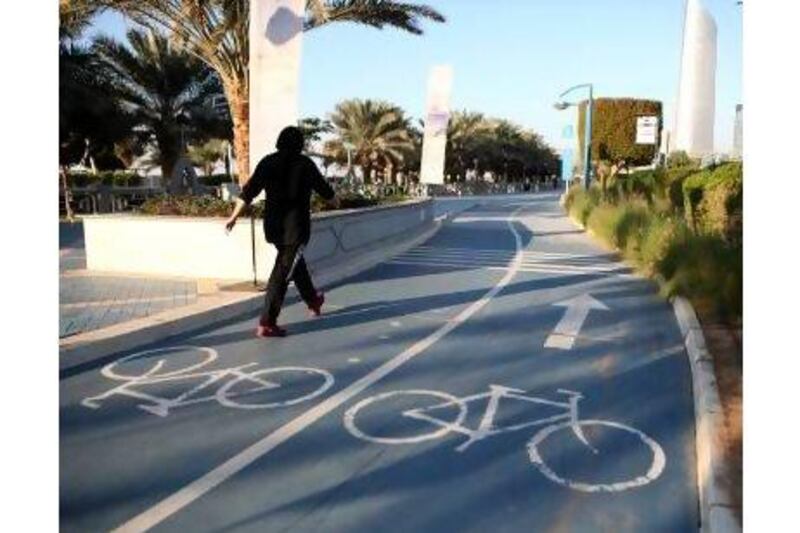The bike lane on the corniche being crowded with pedestrians. Fatima Al Marzooqi/The National