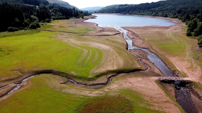 A bridge, which is usually submerged, over the dried bed of Llwyn-on Reservoir, during a heatwave in Wales. Reuters
