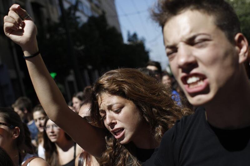 Students shout slogans as they march through Athens city centre during a protest against far-right Golden Dawn party. Kostas Tsironis / AP Photo