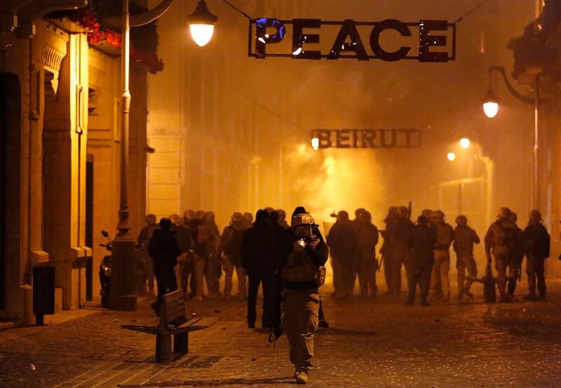 Special forces police advance as they push back the anti-government protesters in downtown Beirut. AP Photo