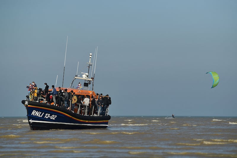 A rescue boat arrives on the English coast after picking up migrants crossing the Channel. AFP