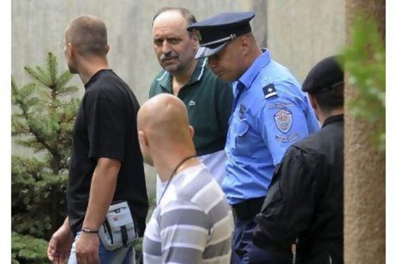 Goran Hadzic, in green shirt, arrives in July this year at the house in Serbia, where he lived before he went hiding in 2004. Authorities tracked him down in the northern mountains, and arrested the last remaining fugitive sought by the UN war crimes court after he spent eight years on the run. AP Photo