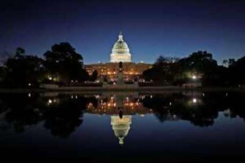 The United States Capitol Building is reflected in the water at sunrise in Washington, October 31, 2008. There are 435 members of the House of Representatives and one third of the 100 U.S. Senators will be up for election when the new U.S. President is elected on November 4. REUTERS/Jim Young    (UNITED STATES) US PRESIDENTIAL ELECTION CAMPAIGN 2008 (USA)