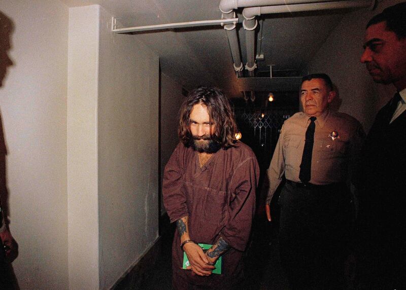 Charles Manson is escorted to court in Los Angeles in 1969. AP Photo