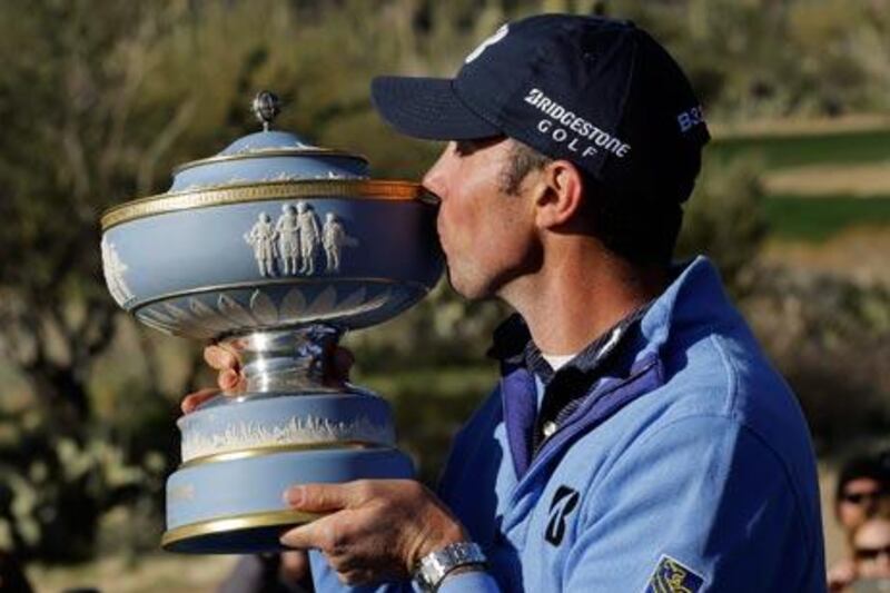 Matt Kuchar kisses the Walter Hagen Cup after defeating Hunter Mahan 2 and 1 in the final round of play during the Match Play Championship golf tournament. Ted S Warren / AP Photo