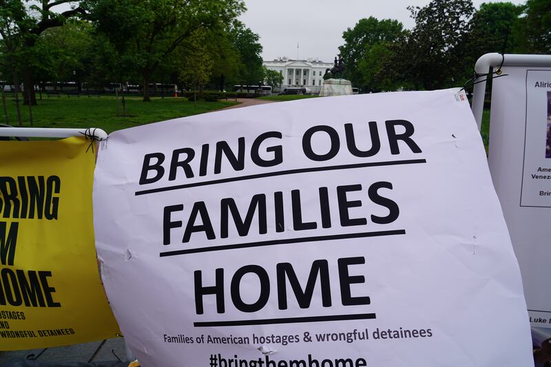 A sign hangs at a rally for the families of Americans wrongfully detained abroad. 