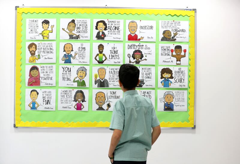 A pupil reads an advice poster in the wellbeing hub.