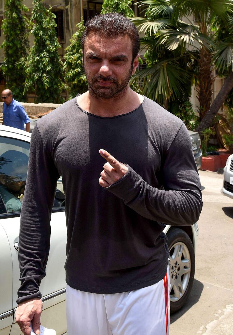 Bollywood actor Sohail Khan poses for photographs after casting his vote at a polling station in Mumbai on April 29, 2019. AFP