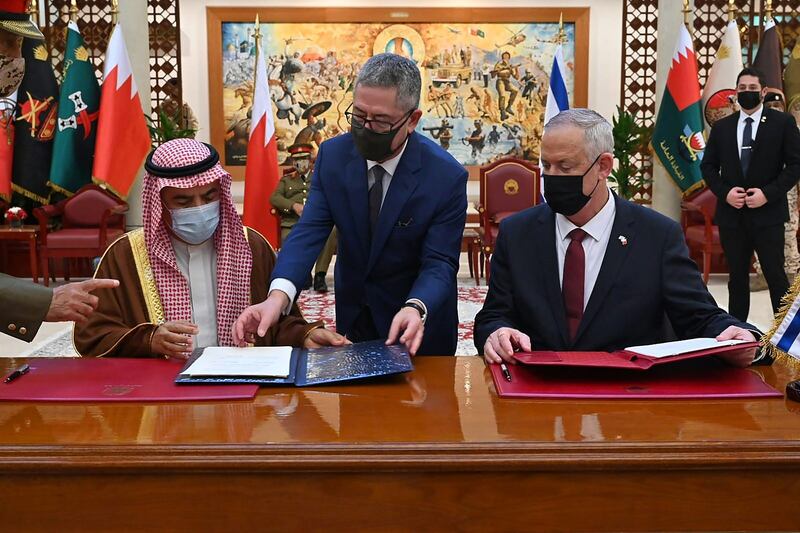 Benny Gantz and Lt Gen Abdullah bin Hassan Al Nuaimi, defence ministers of Israel and Bahrain, respectively, sign a bilateral agreement in the capital, Manama. AFP