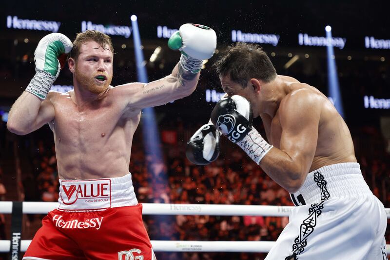 Canelo Alvarez misses a punch against Gennady Golovkin during the fifth round of their title fight. Getty