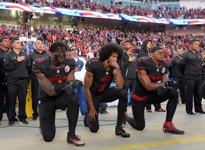 San Francisco 49ers outside linebacker Eli Harold (58), quarterback Colin Kaepernick (7) and free safety Eric Reid (35) kneel in protest during the playing of the national anthem before a NFL game against the Arizona Cardinals in Santa Clara, California, Oct 6, 2016.   Mandatory Credit: Kirby Lee-USA TODAY Sports/File Photo