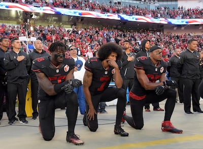 San Francisco 49ers outside linebacker Eli Harold (58), quarterback Colin Kaepernick (7) and free safety Eric Reid (35) kneel in protest during the playing of the national anthem before a NFL game against the Arizona Cardinals in Santa Clara, California, Oct 6, 2016.   Mandatory Credit: Kirby Lee-USA TODAY Sports/File Photo