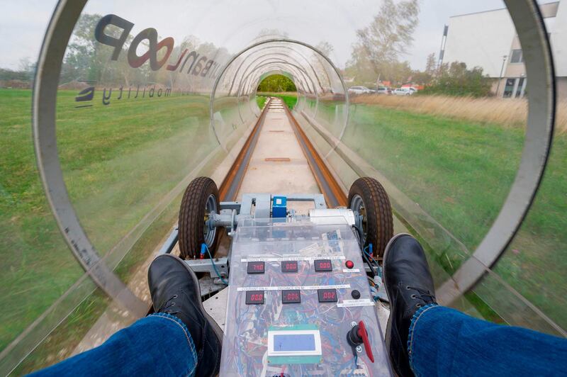 A person drives a prototype on the Urbanloop test loop at the National Polytechnic Institute of Lorraine headquarters in Vandoeuvre-les-Nancy, northeastern France. AFP