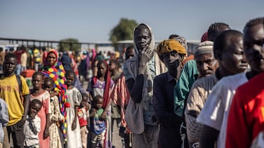 Sudanese refugees who have fled the war cross the South Sudanese border near Renk on February 14. AFP