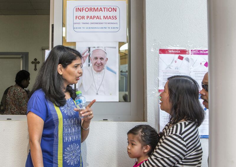 DUBAI, UNITED ARAB EMIRATES -A church volunteer giving information to people regarding the Papal mass at St. Mary's Catholic Church, Oud Mehta.  Leslie Pableo for The National for Anam Rizvi's story