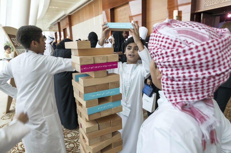 DUBAI, UNITED ARAB EMIRATES, 8 AUGUST 2017. Emirati Abdul Aziz (Center) plays with a giant jenga set at the International Youth Day Celebration at the Intercontinental Hotel in Festival City. (Photo: Antonie Robertson/The National) Journalist: Caline Malik. Section: National.