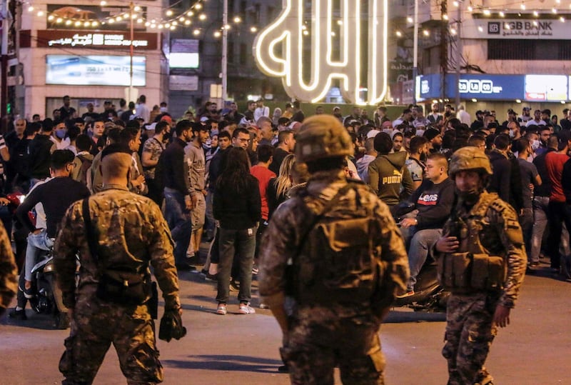 Lebanese people protest in the northern city of Tripoli on April 17, 2020 despite the country's coronavirus lockdown. AFP