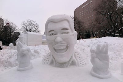 A sculpture of the Japanese artist Piko taro can be seen at the snow festival in Sapporo, Japan, 6 February 2017. Taro gained fame by propelling a 45 second song "Pen Pineapple Apple Pen" into the US hit charts. Photo by: Lars Nicolaysen/picture-alliance/dpa/AP Images