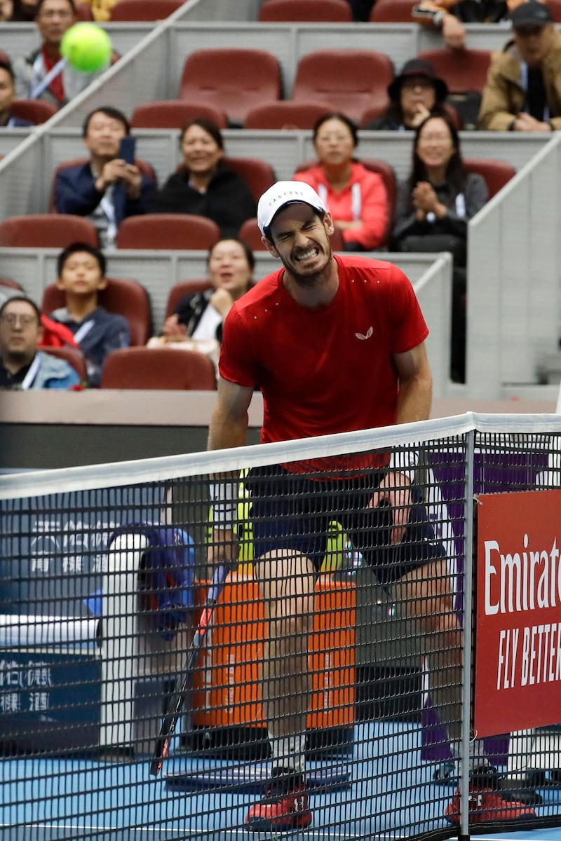 Andy Murray of Britain reacts during the men's singles quarterfinal match against Dominic Thiem of Austria in the China Open tennis tournament at the Diamond Court in Beijing, Friday, Oct. 4, 2019. (AP Photo/Mark Schiefelbein)