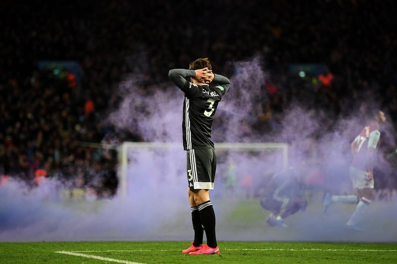 Ben Chilwell of Leicester City after the final whistle as flare smoke covers the Villa Park pitch. Getty Images