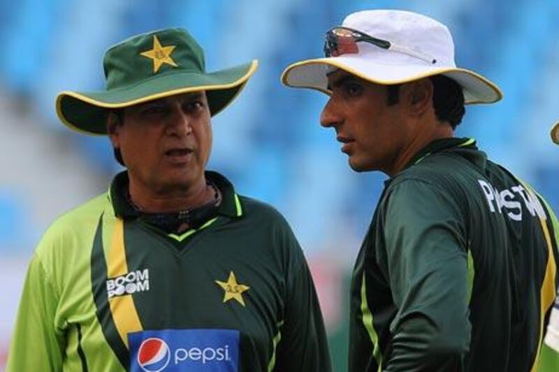 Misbah-ul-Haq, the Pakistan captain, right, talks to Mohsin Khan, the coach, at a practice session in Dubai  yesterday.