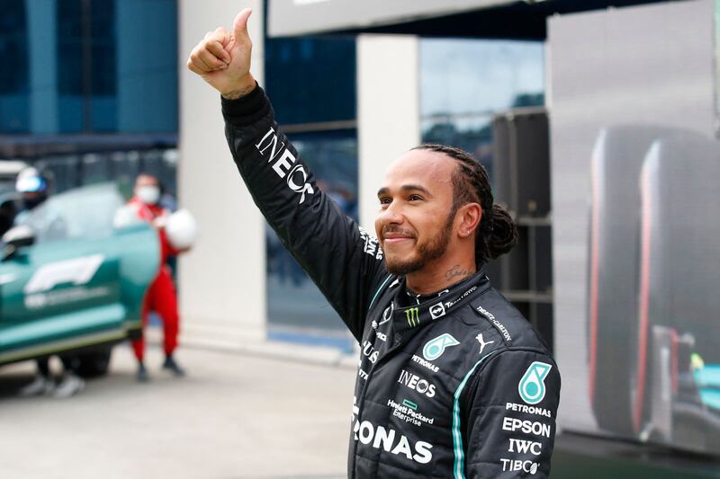 Mercedes' British driver Lewis Hamilton gives a thumbs up after the qualifying sessions at the Intercity Istanbul Park on Saturday, October 9, 2021, for the Turkish Grand Prix. AFP