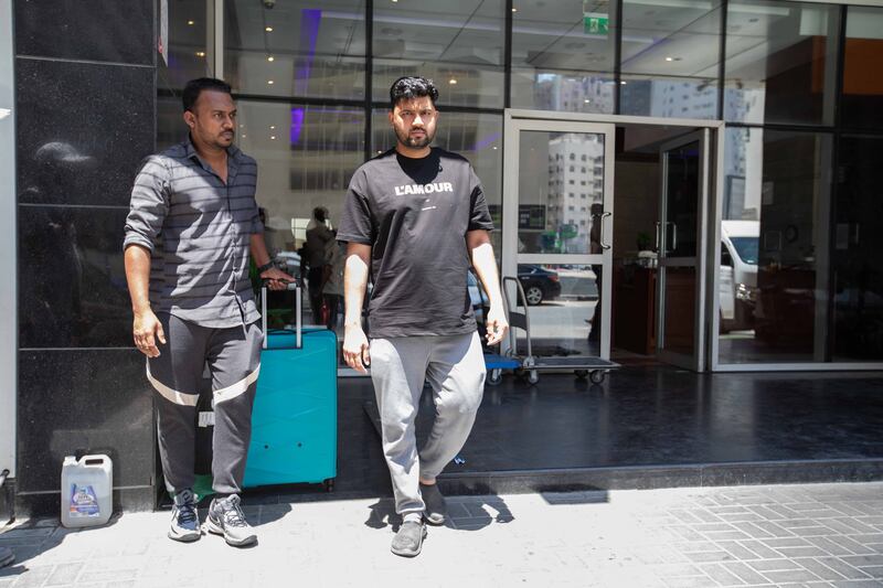Najed Nujumuddin, left, and his friend Noufal Faziludeen both live in the building and escaped on Thursday night