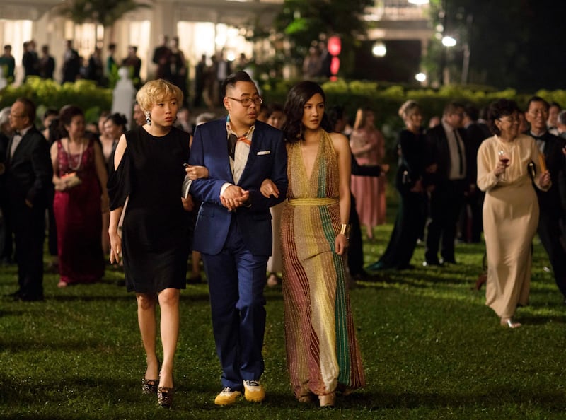 This image released by Warner Bros. Entertainment shows Awkwafina, from left, Nico Santos and Constance Wu in a scene from the film "Crazy Rich Asians." (Sanja Bucko/Warner Bros. Entertainment via AP)