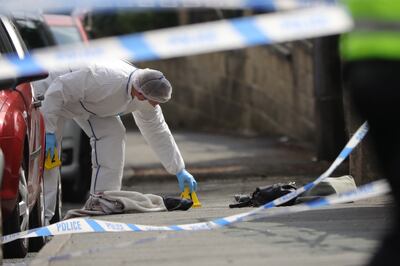 Forensic police examine the scene after MP Jo Cox was murdered in 2016. Getty Images