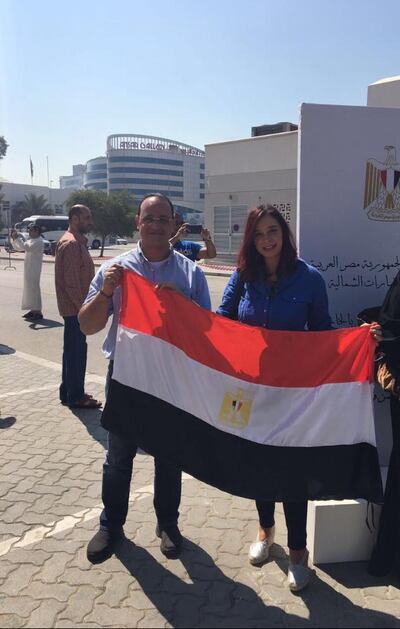 Sally Kotb and her brother Ahmed Kotb after voting the Egyptian consulate in Dubai, UAE