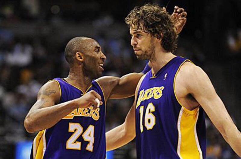 The Magic's Dwight Howard will guard Pau Gasol, right, closely potentially leaving the way clear for Kobe Bryant, left.