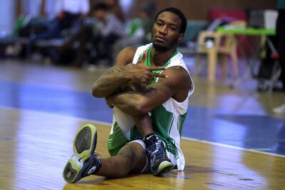 Baghdad's Oil Club guard DeMario Mayfield stretches during a team training session ahead of their match against Iraq's Airline Club, in Baghdad on December 7, 2017.
DeMario Mayfield feared it was the end of his basketball career when he was arrested for planning a robbery, but the former US college star is bouncing back -- in war-torn Iraq. 

Originally from Georgia in America's deep south, the 6 foot five inch (1.95 metre) player is now leading Iraq's national team after taking citizenship following a 2015 club move to Baghdad. / AFP PHOTO / Ahmad al-Rubaye