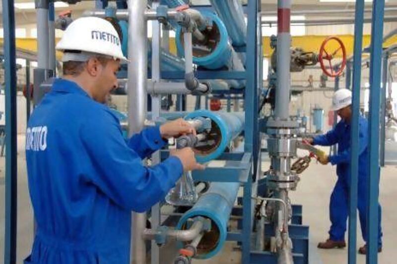 Workers at Metito's desalination plant in Dubai. The firm is looking into solar desalination.