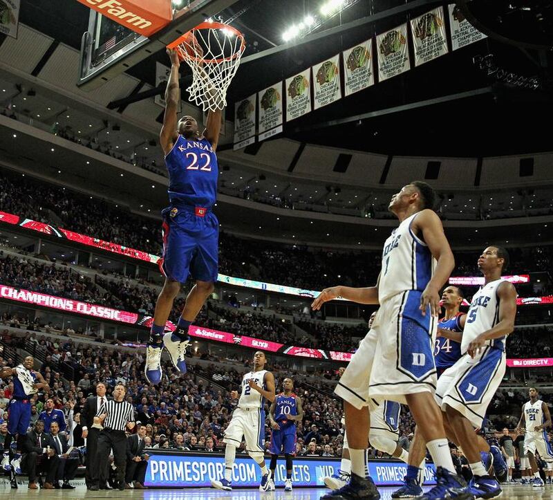 Kansas Jayhawks’ Andrew Wiggins, left, will be high on many basketball teams’ wishlists for the 2014 NBA draft. Jonathan Daniel / Getty Images