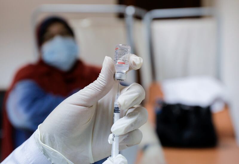 A nurse prepares a dose of the Sinovac Covid-19 shot at Cairo University. Reuters