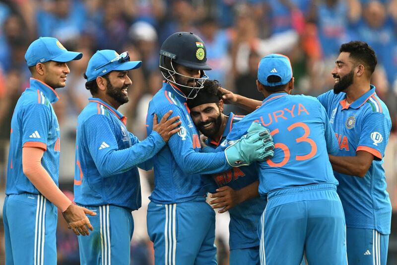 India's Ravindra Jadeja celebrates with teammates after taking the wicket of Pakistan's Haris Rauf. AFP