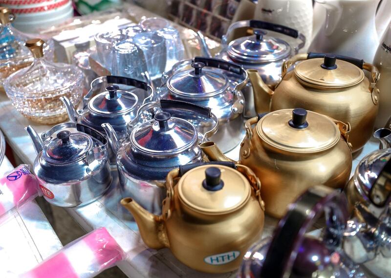 Abu Dhabi, United Arab Emirates, December 10, 2019.  
  --Teapots for sale at Al Mansoori Supply general store on Millions Street at Al Dhafra Festival.
Victor Besa/The National
Section:  NA
Reporter:  Anna Zacharias
