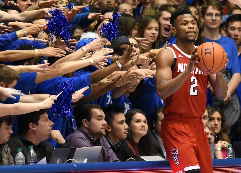 North Carolina State Wolfpack guard Torin Dorn is harassed by Duke Blue Devils fans during a game in Durham, North Carolina. Reuters