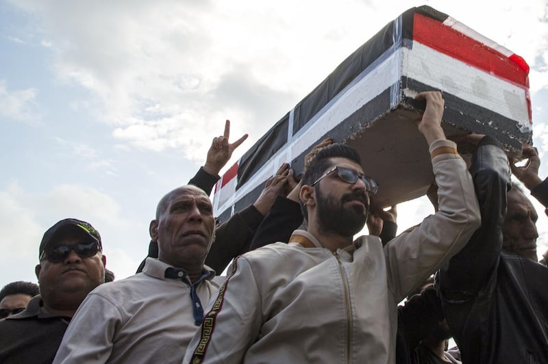 Iraqis carry mock coffins as they take part in a rally to mourn Ahmad Abdessamad, a correspondent for local television station Al-Dijla, and his cameraman Safaa Ghali were shot dead late Friday in Basra. AFP