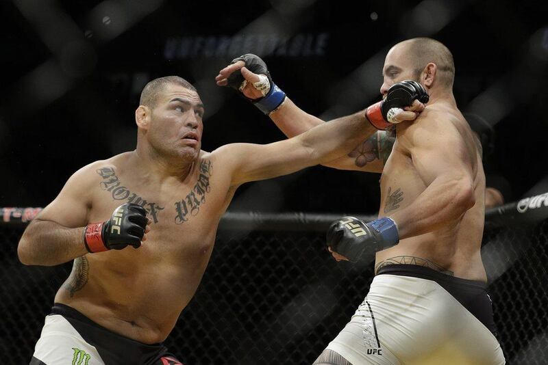 Cain Velasquez, left, fights Travis Browne during their heavyweight bout at UFC 200, Saturday, July 9, 2016, in Las Vegas. John Locher / AP Photo
