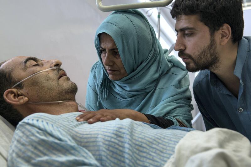 Shir Ali, 49, lies in hospital with his wife Qudsia, 48, and son by his side. The shock and pain of Monday's attack is raw. 