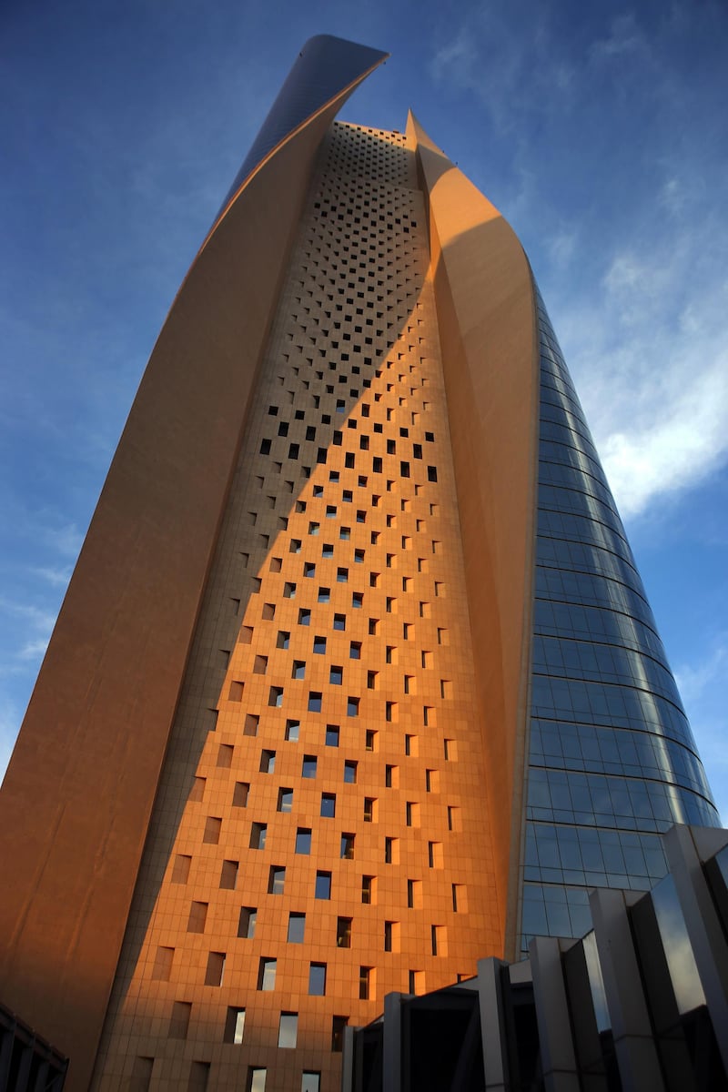 A picture taken on December 19, 2014 shows a view of al-Hamra Tower in Kuwait City. The tower is the tallest skyscraper in Kuwait and one of the top 10 tallest towers in the world. The tower is 450 metre-high and has 77 floors and 100,000 square meters of commercial and office space, as well as movie theatres, a rooftop restaurant and a spa.   AFP PHOTO / YASSER AL-ZAYYAT (Photo by YASSER AL-ZAYYAT / AFP)