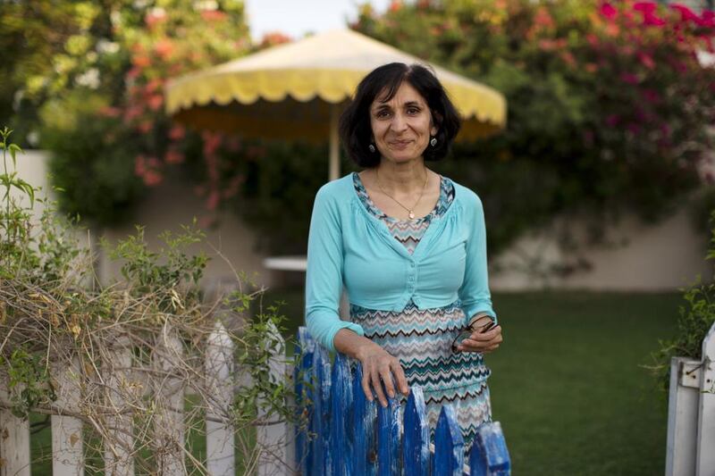 Lubna Sarwar, a semi-retired primary school teacher, at her Flamingo Villa home in Al Sufouh, Dubai, last month. “I want children to look back and say I had a memorable lesson ... that’s the idealist in me.” Christopher Pike / The National 