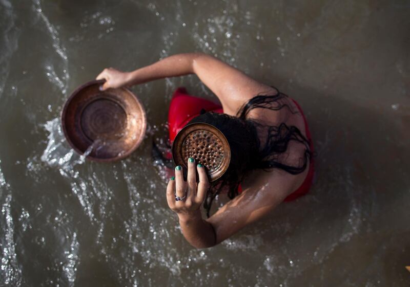 Nepalese women take a holy bath in the Manhara River as they mark the Rishi Panchami in Kathmandu, Nepal.  Narenda Shrestha / EPA