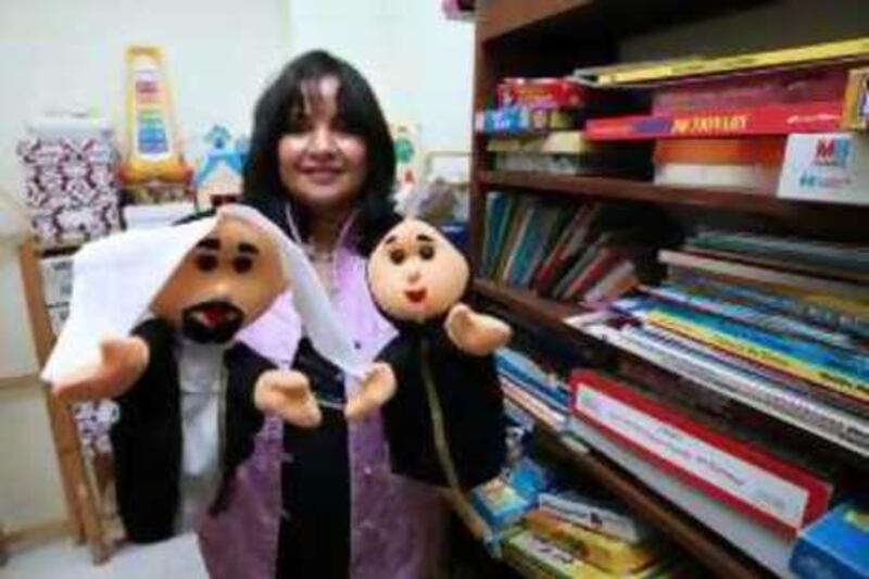 DUBAI-SEPTEMBER 11,2008 - Dr. Rajeshree Udani Singhania, Neurodevelopmental Paediatrician hold a puppets she use in entertaining her patients at her clinic. She deals with children suffering from  behaviour problems,educational difficulties like autism. ( Paulo Vecina/The National )  *** Local Caption ***  PV Singhania 7.JPGPV Singhania 7.JPG